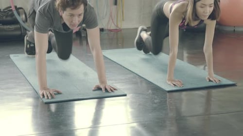 Young asian man and woman workout with strong at gym, asia male and girl training exercise sport.