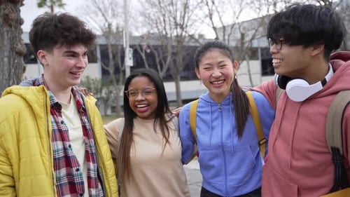 Smiling Friends Together Outdoors in Urban Setting