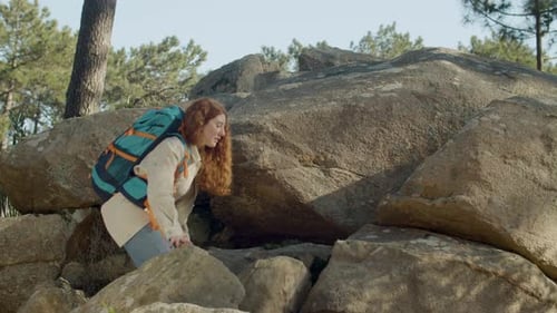 Young Female Backpacker Climbing Mountain Hill While Hiking