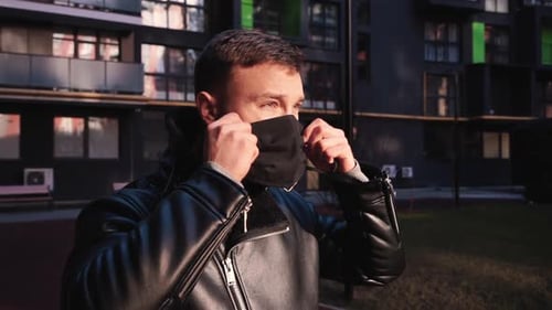 Man Wearing Black Face Mask Outdoors