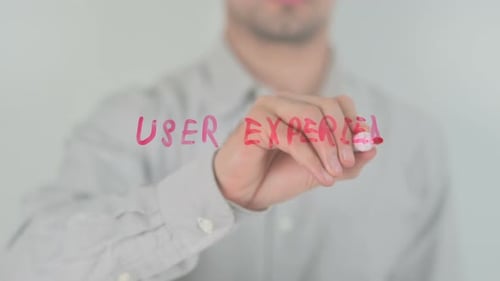 Man Writes 'User Experience' With a Red Marker