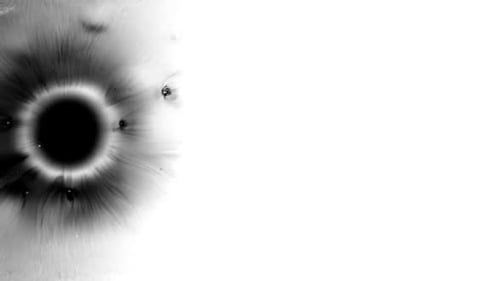 Abstract Black Ink Spreading on White Background