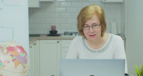 Woman Teaching Online Lesson from Home