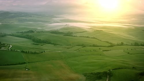 Flying over the foggy Tuscany Italy landscape