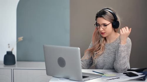 Woman Working from Home on a Video Conference