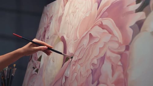 Artist Hand Painting Pink Floral Design on Canvas