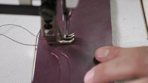 Craft Leather Workshop and Manufacture. Close-up of Master Sewing Pieces of Leather, Stitches Straps