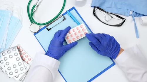 Top view on a white work desk of a doctor