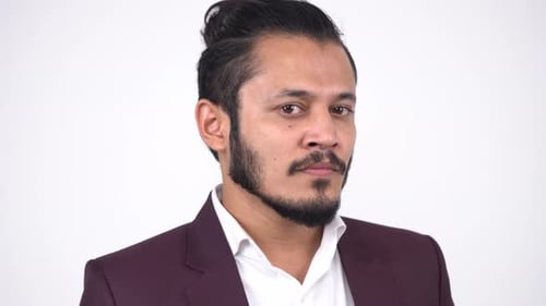 Man with Beard Wearing Burgundy Suit in Studio