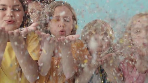 Children Blowing Sparkles off Hands