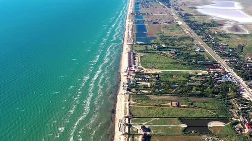 Beautiful flight in summer over the beach, People are resting near the sea, Houses for tourists