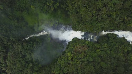 Aerial View of Tropical Rainforest Waterfall