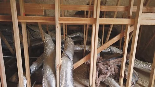 Unfinished Attic with Insulation and Ductwork
