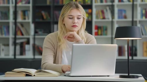 Young Girl Having Headache While Working on Laptop