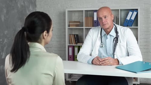 Doctor Consults with Patient in a Modern Office