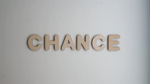 Wooden Letters Spelling Chance on Gray Background