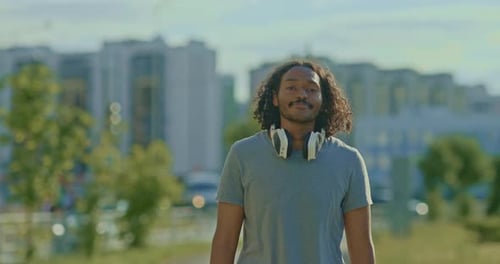 Happy Man is Walking Down the Street He is Smiling