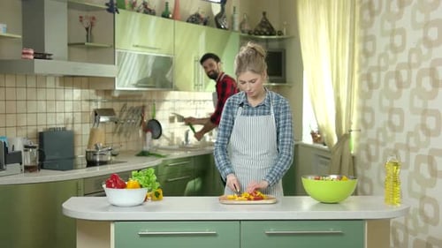 Couple Cutting Vegetable.