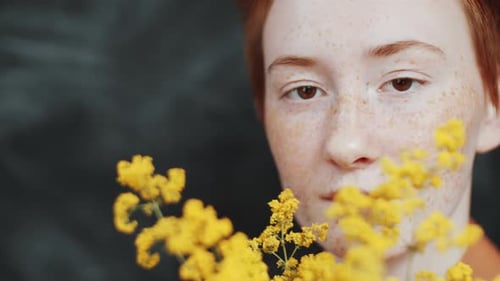 Red Haired Model With Yellow Flowers