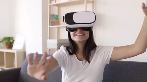 Woman Using VR Headset in Bright Living Room