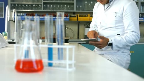 Scientist using digital tablet in laboratory
