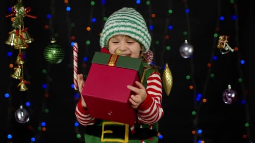 Child Elf Receiving Christmas Gift Decoration