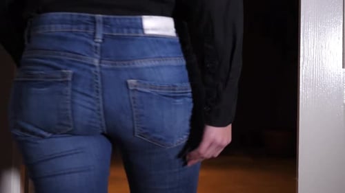 Person Puts Hands on Jeans Rear