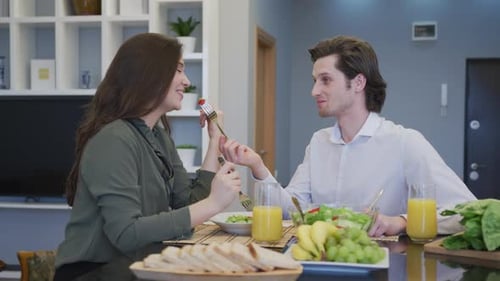 Young Couple Enjoying Healthy Meal at Home