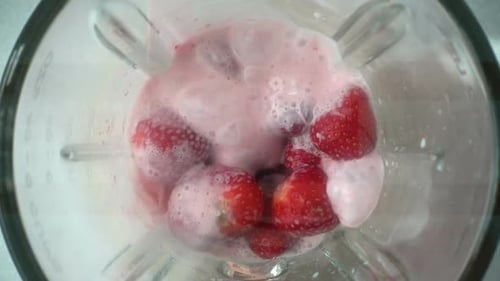 Strawberries Blending Into a Smoothie in a Blender