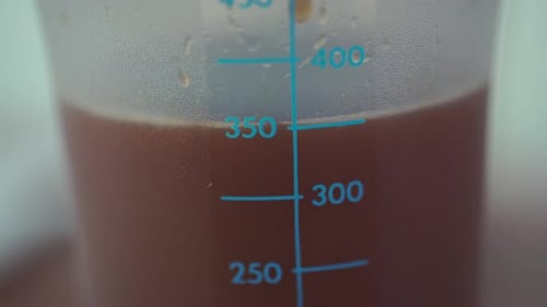 Liquid Being Measured in Plastic Beaker