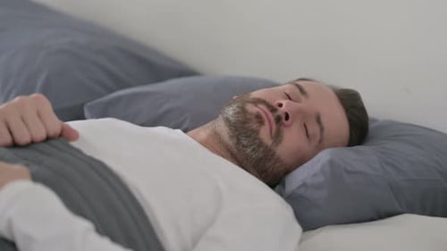 Man Unable to Sleep in Bed