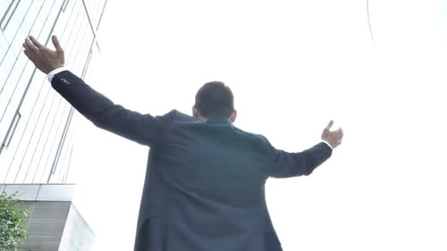 Successful Businessman Celebrating in City Center