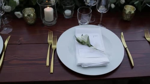 Elegant Wedding Table Setting With Gold Cutlery