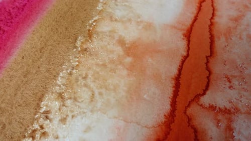 Macro Shot of Flowing Watercolor Paint on Paper