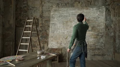 Artist Paints in Urban Studio