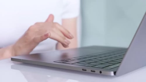 closeup woman hands typing on laptop keyboard. Spbd working from home or office