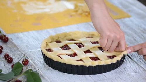 Cherry Pie Creation: Pastry Chef Assembles Lattice Crust