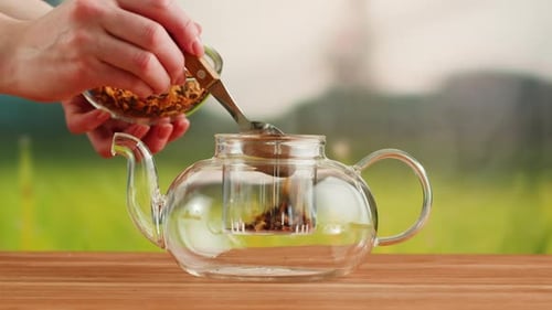 Tea Leaves Poured into Teapot