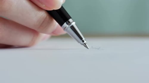 Close up of Person Putting Signature