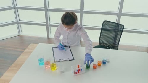 Child Scientist Performing Experiment in Lab