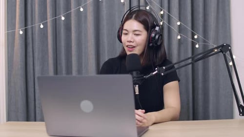 Woman Broadcasting from Home Studio