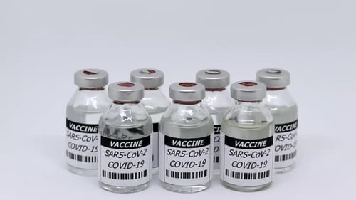 Vaccine Vials for SARS-CoV-2 COVID-19 on White Surface