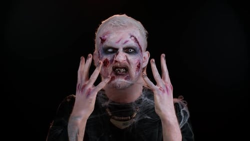 Grotesque Zombie Makeup and Bloody Hands
