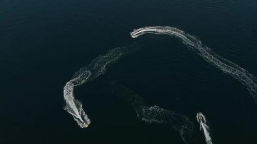 Many Jet Skis Ride in a Circle in One Place. Crazy Fun on the Water. Extreme Jet Skiing. The View