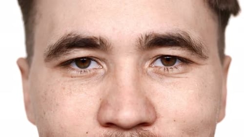 Macro View of Handsome Man Having Hazel Eyes Looking at Camera with Kind Glance and Smile Isolated