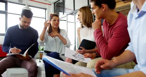Coworkers Brainstorming in Modern Bright Office Meeting