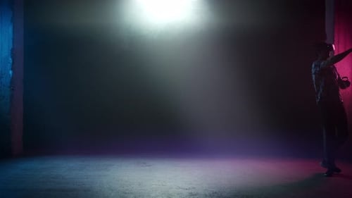 Adult Plays Virtual Reality Game with Controllers