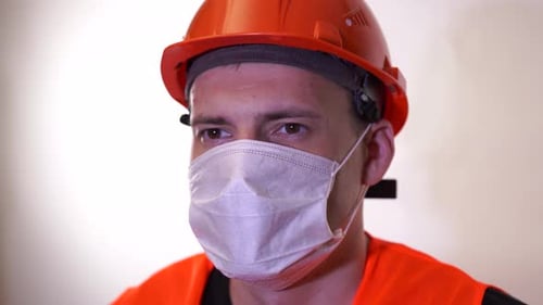Man with Safety Hat and Face Mask Close Up
