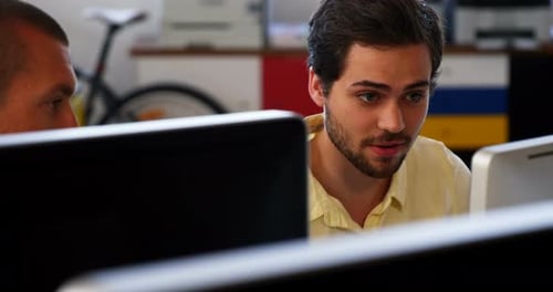 Business executives working over computer