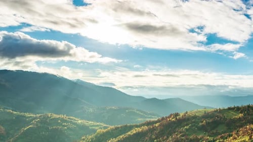Time Lapse of Blue Sky with Clouds Over Mountain